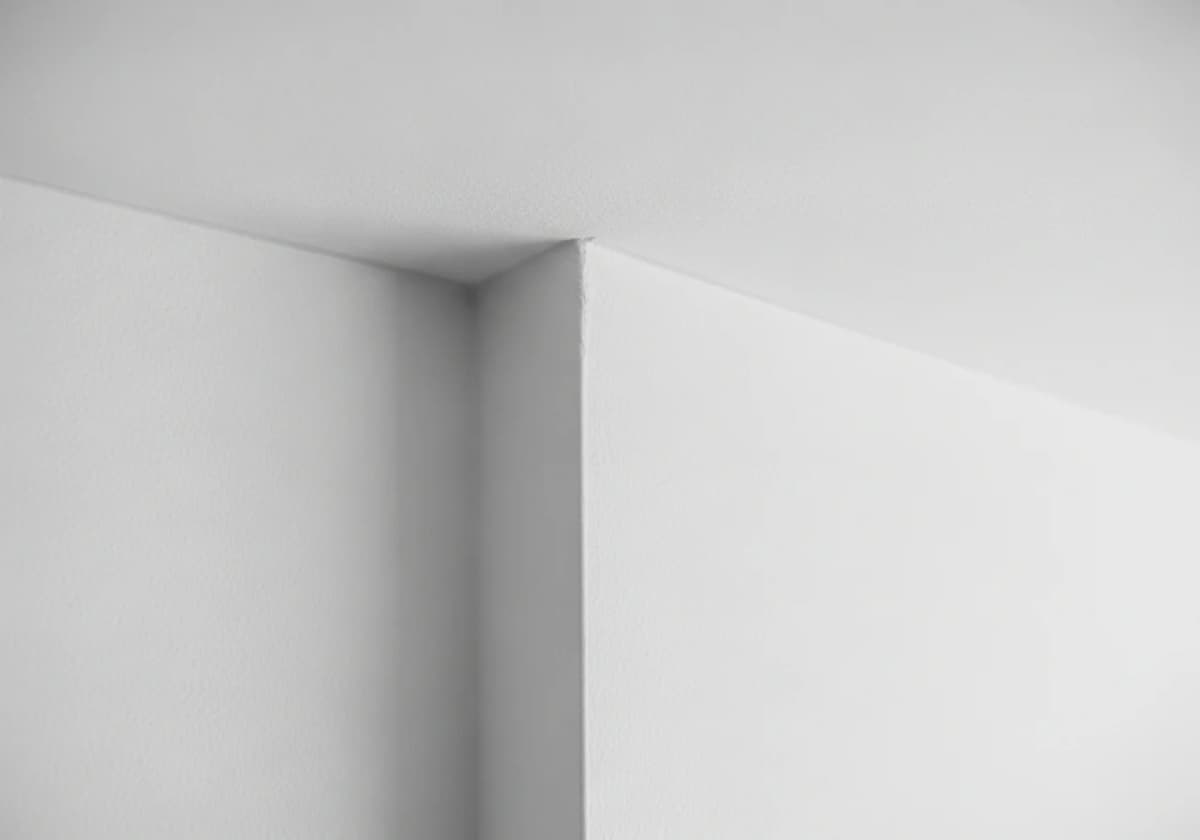 Close-up of a freshly skim-coated smooth ceiling meeting the wall in a Boise home