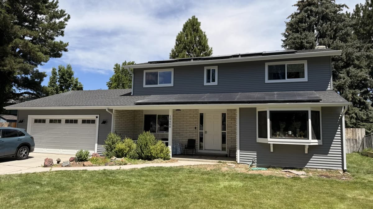 Front of a Boise two-story home with new gray Mastic Ovation vinyl siding and white-trimmed windows