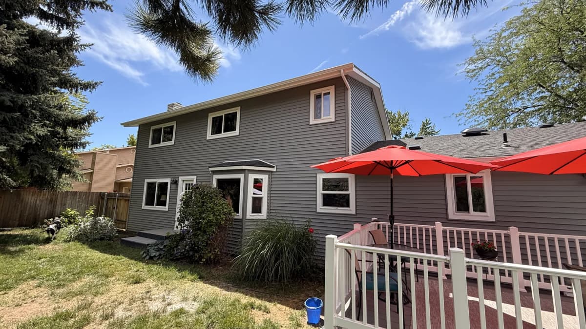 Two-story side and rear of a Boise home finished in gray vinyl lap siding