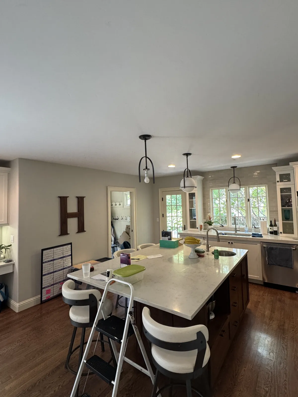 Original Eagle kitchen island and white perimeter cabinets before remodeling