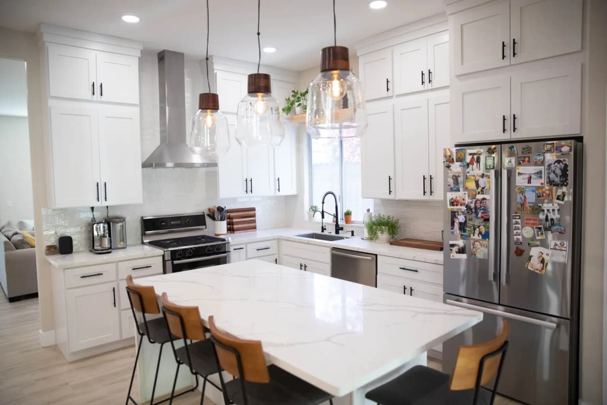 Marble-look quartz island with seating in a remodeled Boise kitchen